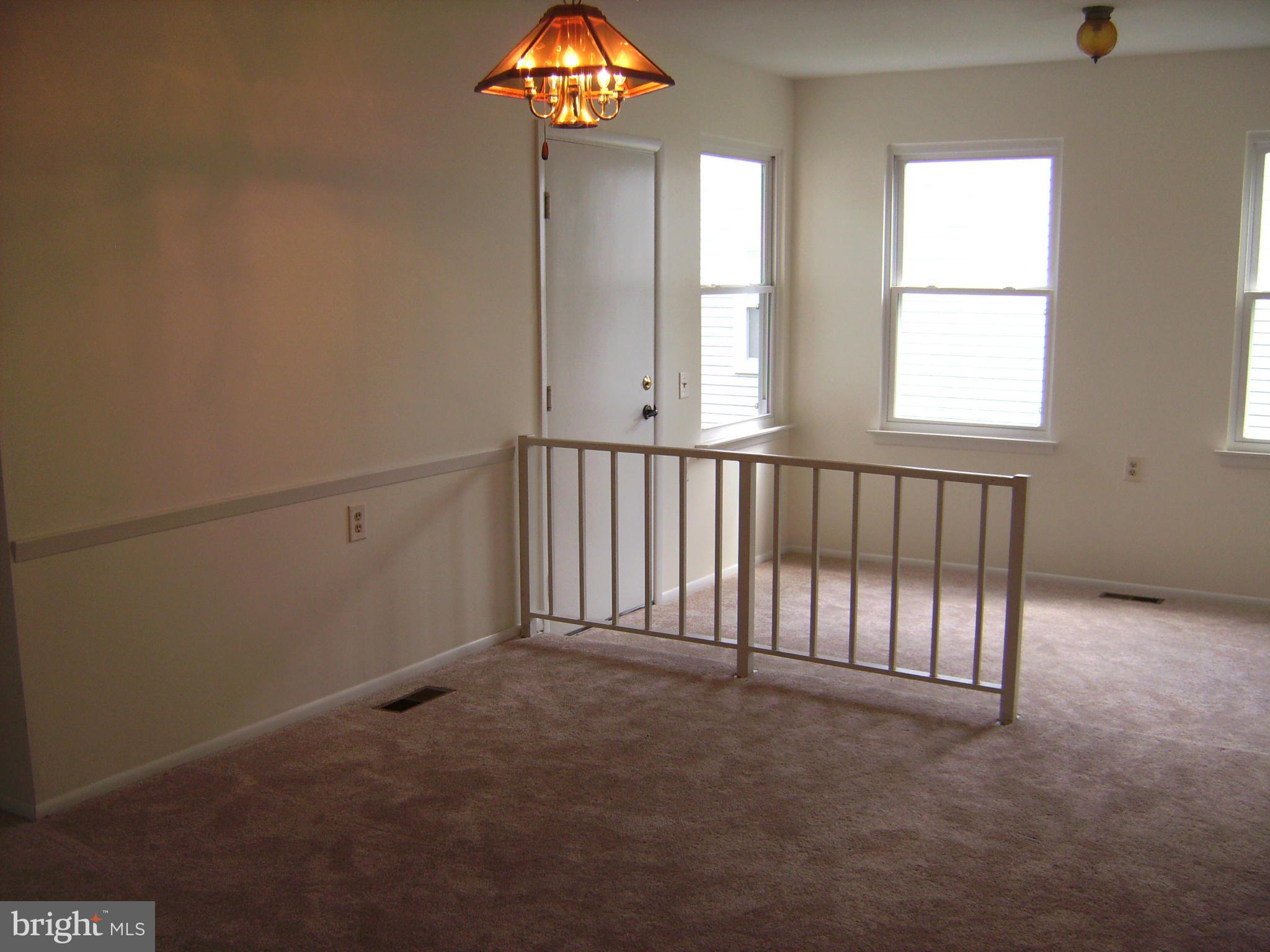 7096 Catalpa Road Frederick, MD 21703 - Photo 7 of 20 an empty room with windows