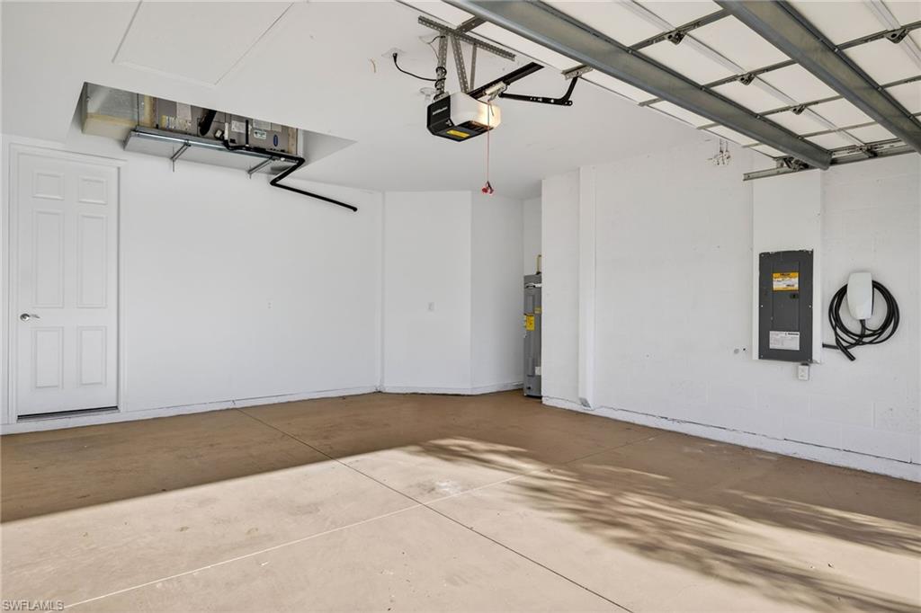 14567 Edgewater Circle Naples, FL 34114 - Photo 28 of 43 a view of a room with rack on the wall