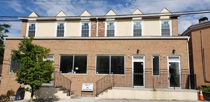 a front view of a house with a porch