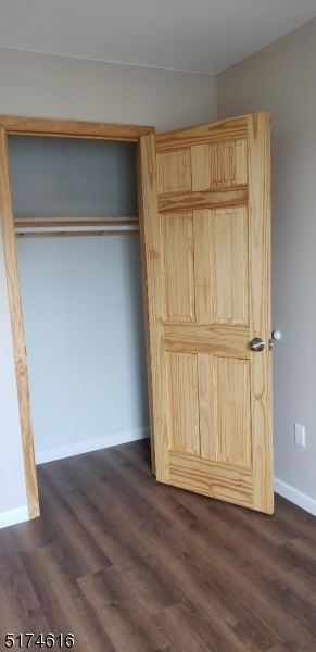 67 Main Street, Unit 2 Stanhope, NJ 07874 - Photo 11 of 19 a view of an empty room with wooden floor and a window