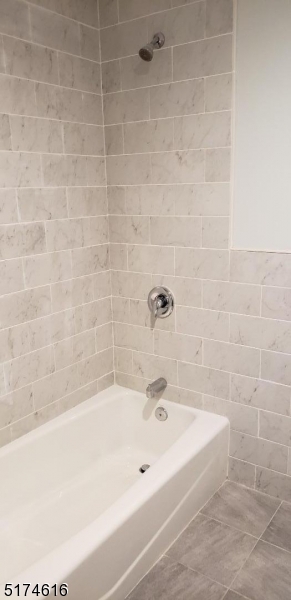 67 Main Street, Unit 2 Stanhope, NJ 07874 - Photo 12 of 19 a bathroom with a bathtub
