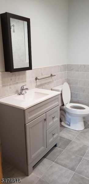 67 Main Street, Unit 2 Stanhope, NJ 07874 - Photo 13 of 19 a bathroom with a toilet sink and mirror