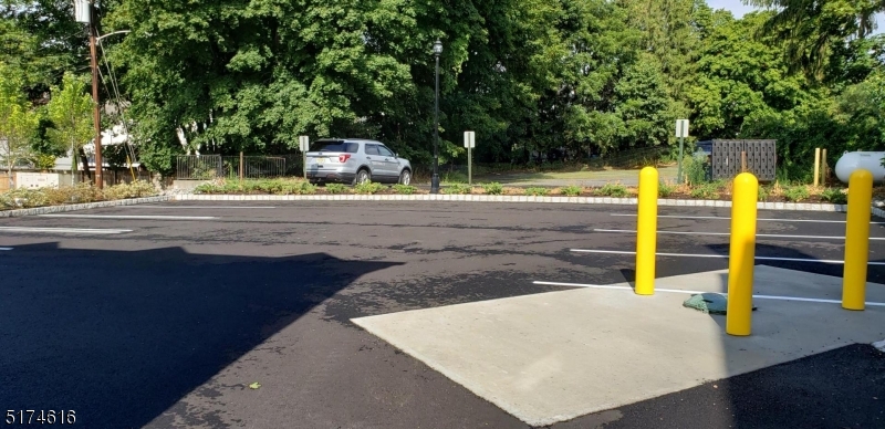 67 Main Street, Unit 2 Stanhope, NJ 07874 - Photo 17 of 19 a view of a swimming pool with an outdoor seating