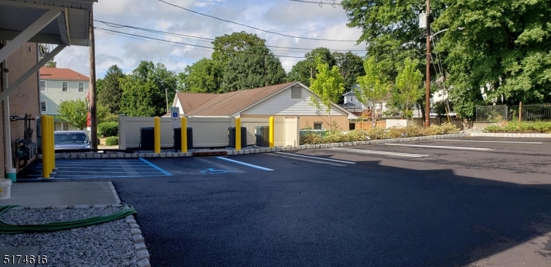 67 Main Street, Unit 2 Stanhope, NJ 07874 - Photo 19 of 19 a house with lots of trees in the background