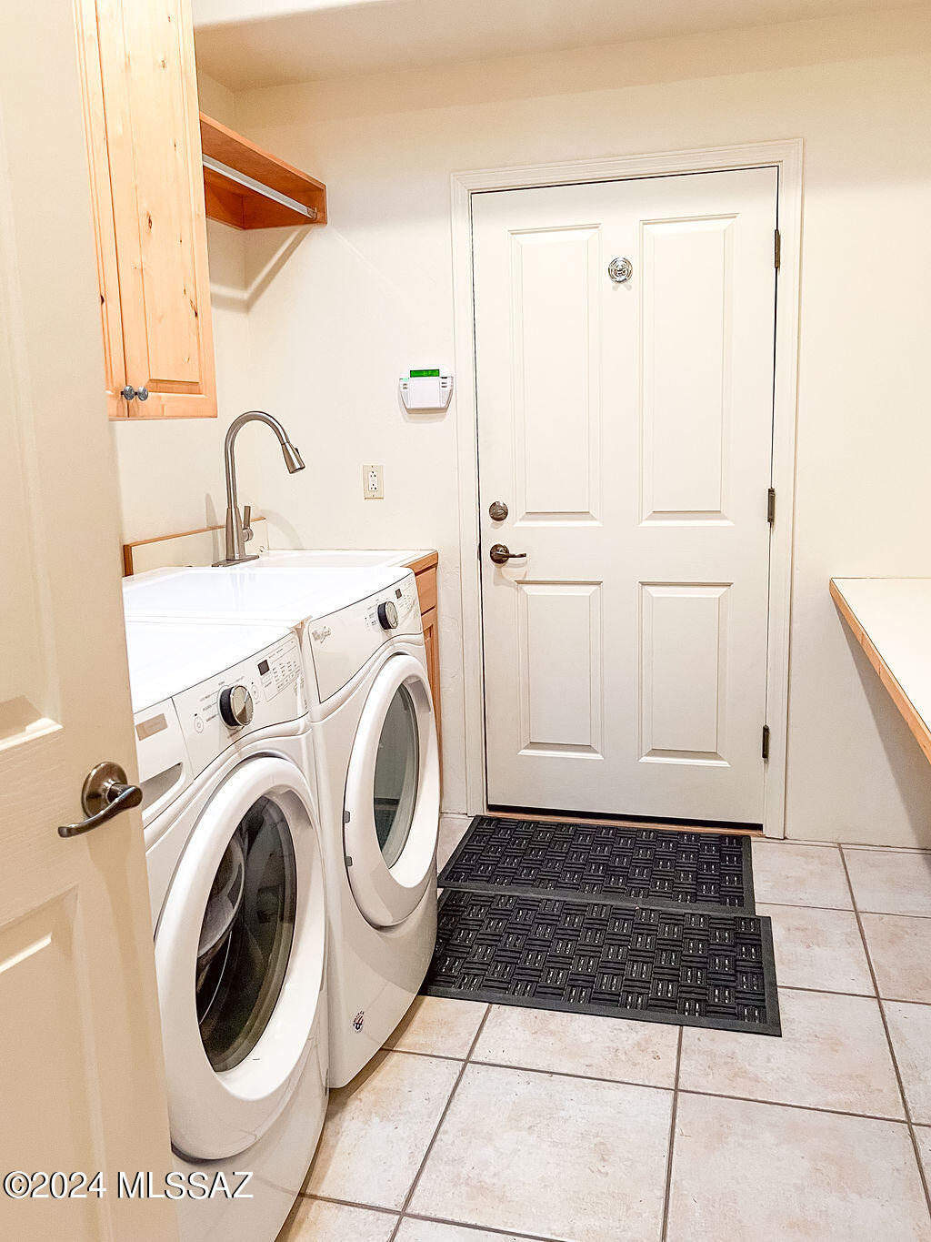 771 West Sedona Ridge Place Oro Valley, AZ 85755 - Photo 19 of 22 a view of a kitchen with sink and washing machine