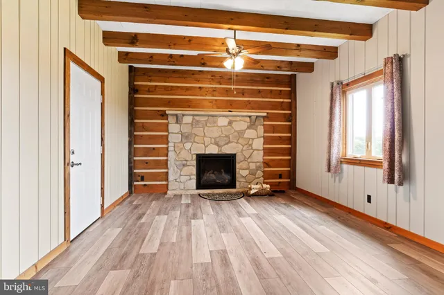 a backyard of a house with wooden floor and stairs