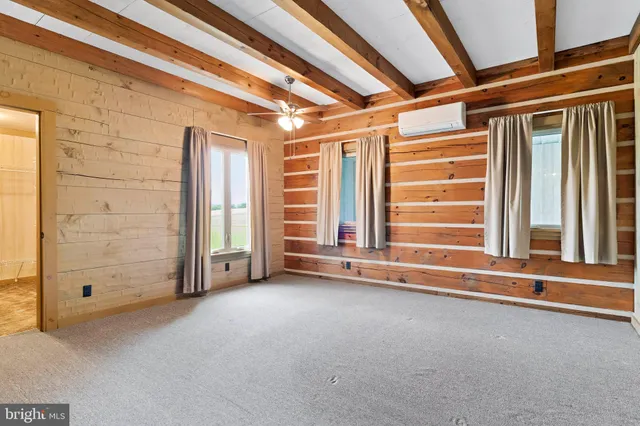 a bedroom with furniture and a window
