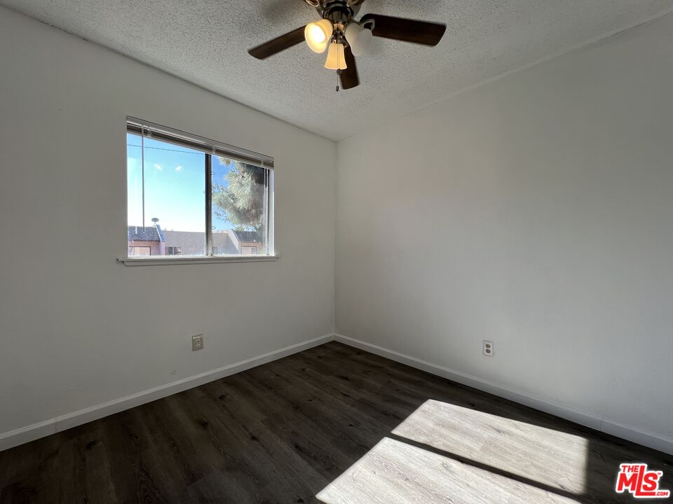 418 West Jackson Street Rialto, CA 92376 - Photo 14 of 24 a view of empty room with wooden floor