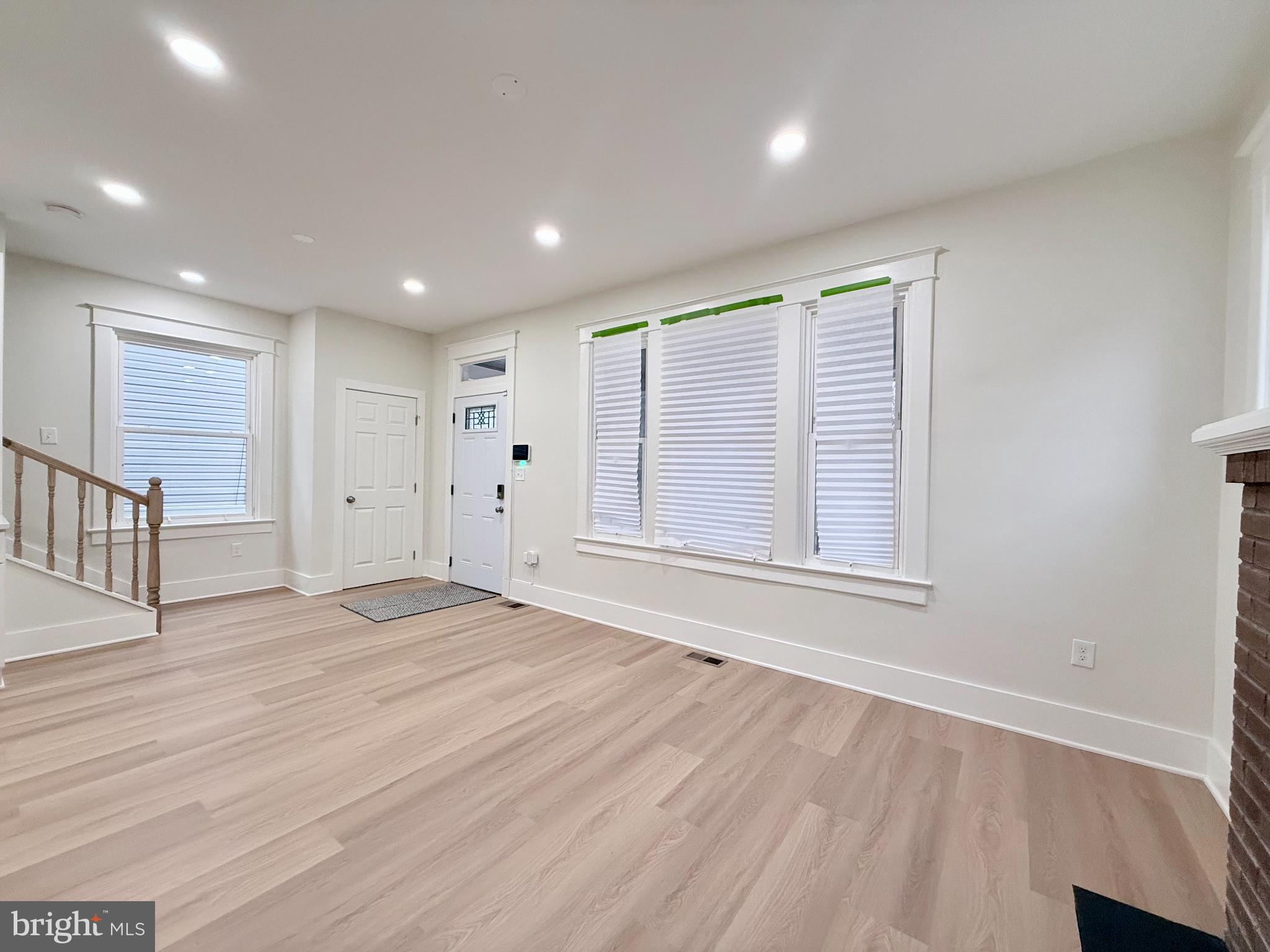610 Raleigh Place Southeast Washington, DC 20032 - Photo 4 of 15 a view of empty room with wooden floor and fan