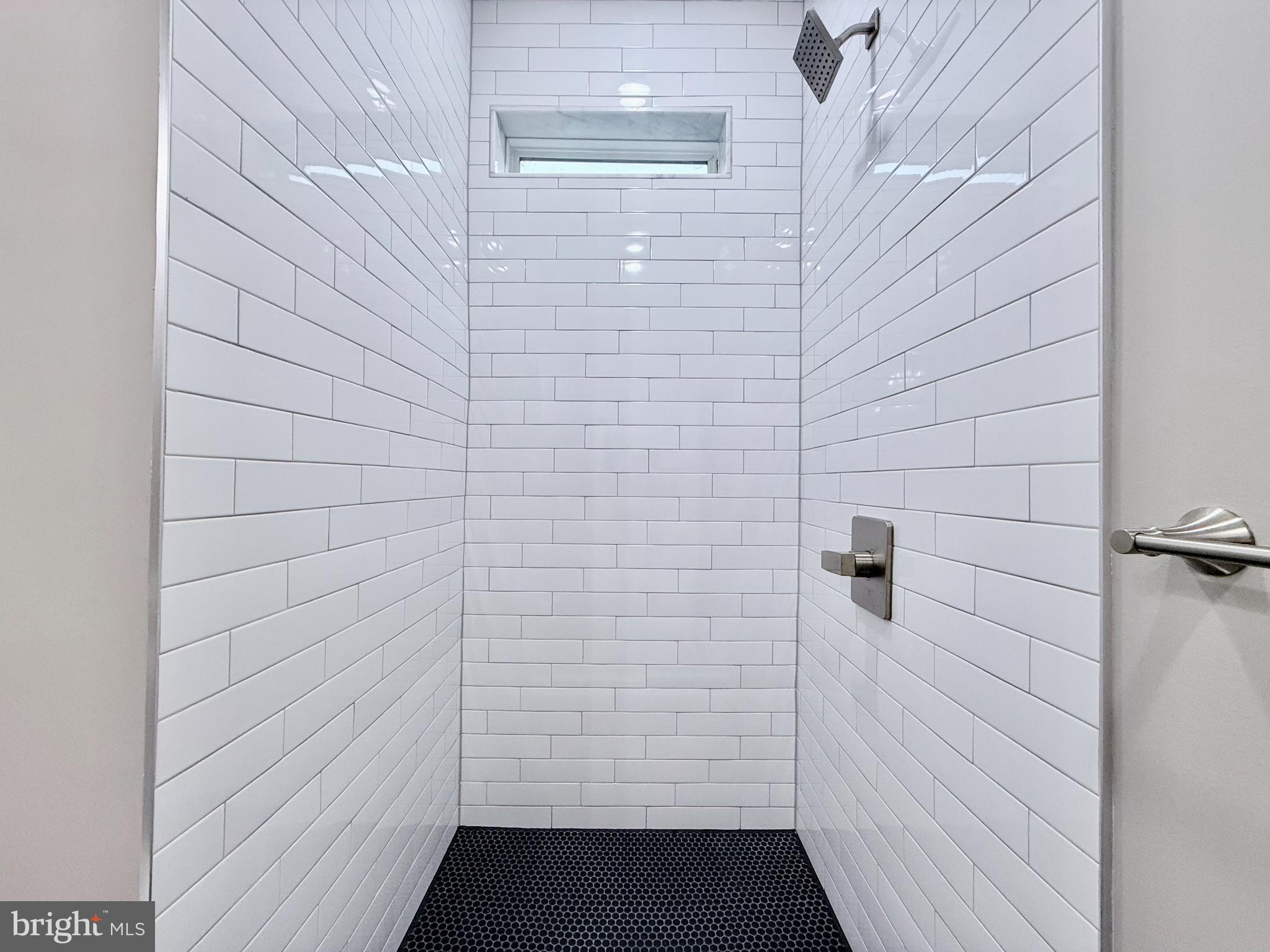 610 Raleigh Place Southeast Washington, DC 20032 - Photo 10 of 15 a bathroom with a shower