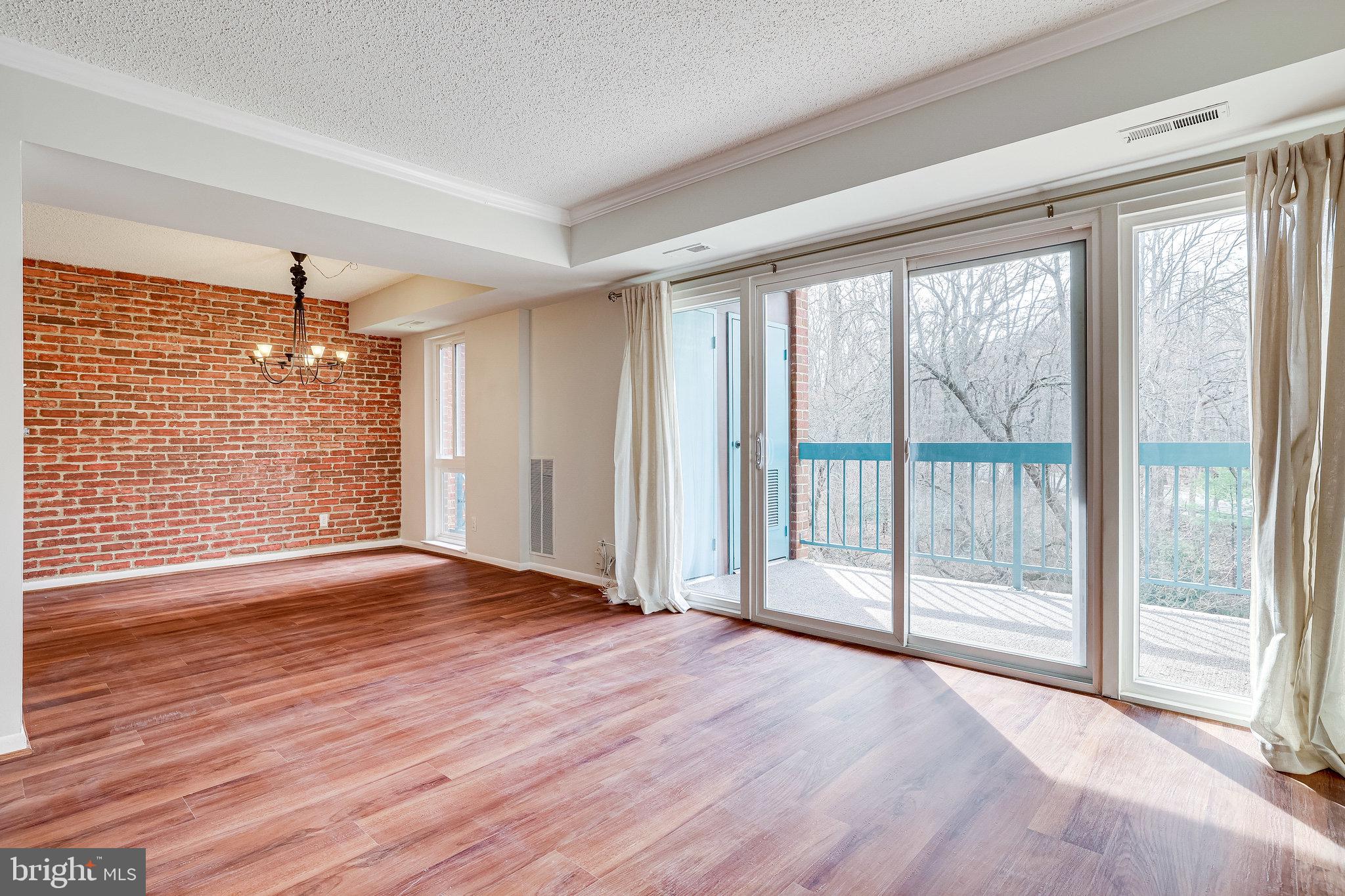 11843 Shire Court, Unit 22C Reston, VA 20191 - Photo 6 of 28 Living / Dining / Balcony