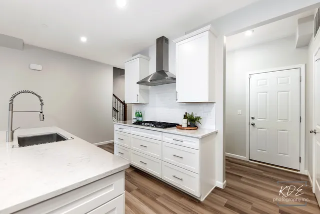 a kitchen with a sink and cabinets