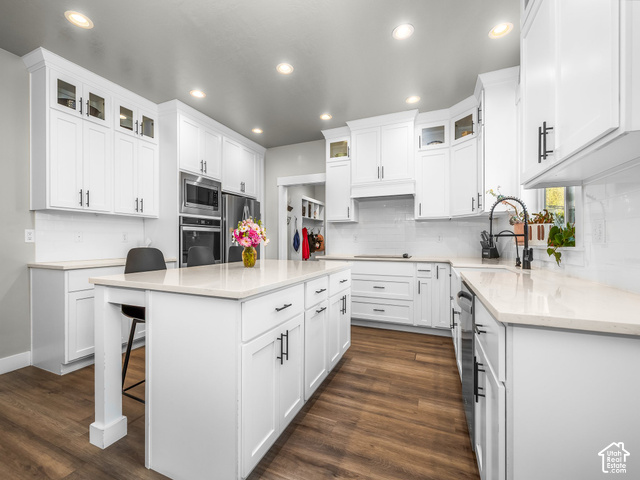 474 North 150th Street East Mapleton, UT 84664 - Photo 9 of 35 Kitchen featuring white cabinetry, wood-finish flooring, recessed lighting, a center island with countertop, and stainless steel appliances