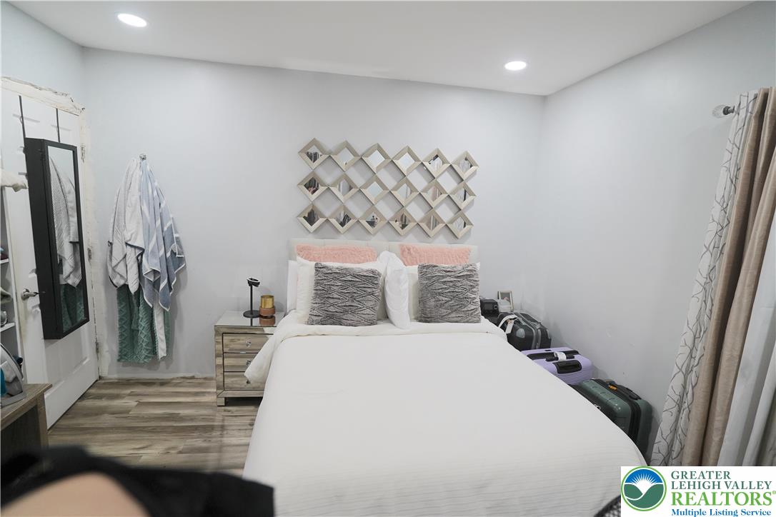 3863 Mauch Chunk Road Coplay, PA 18037 - Photo 18 of 33 a bedroom with a bed and a flat screen tv
