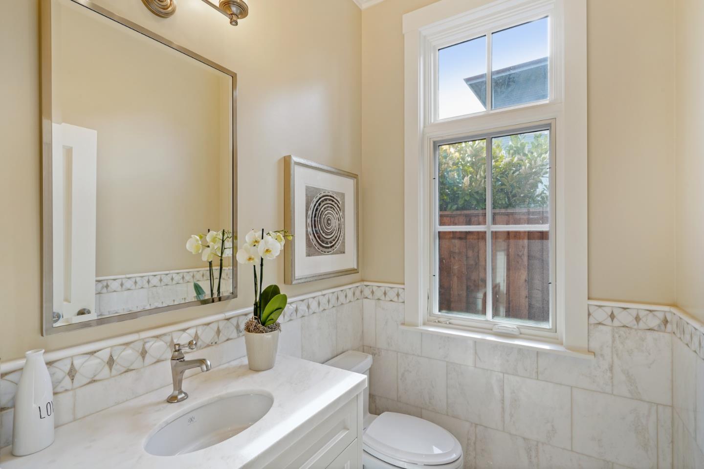 88 Warren Road San Mateo, CA 94401 - Photo 39 of 50 a bathroom with a sink and a toilet