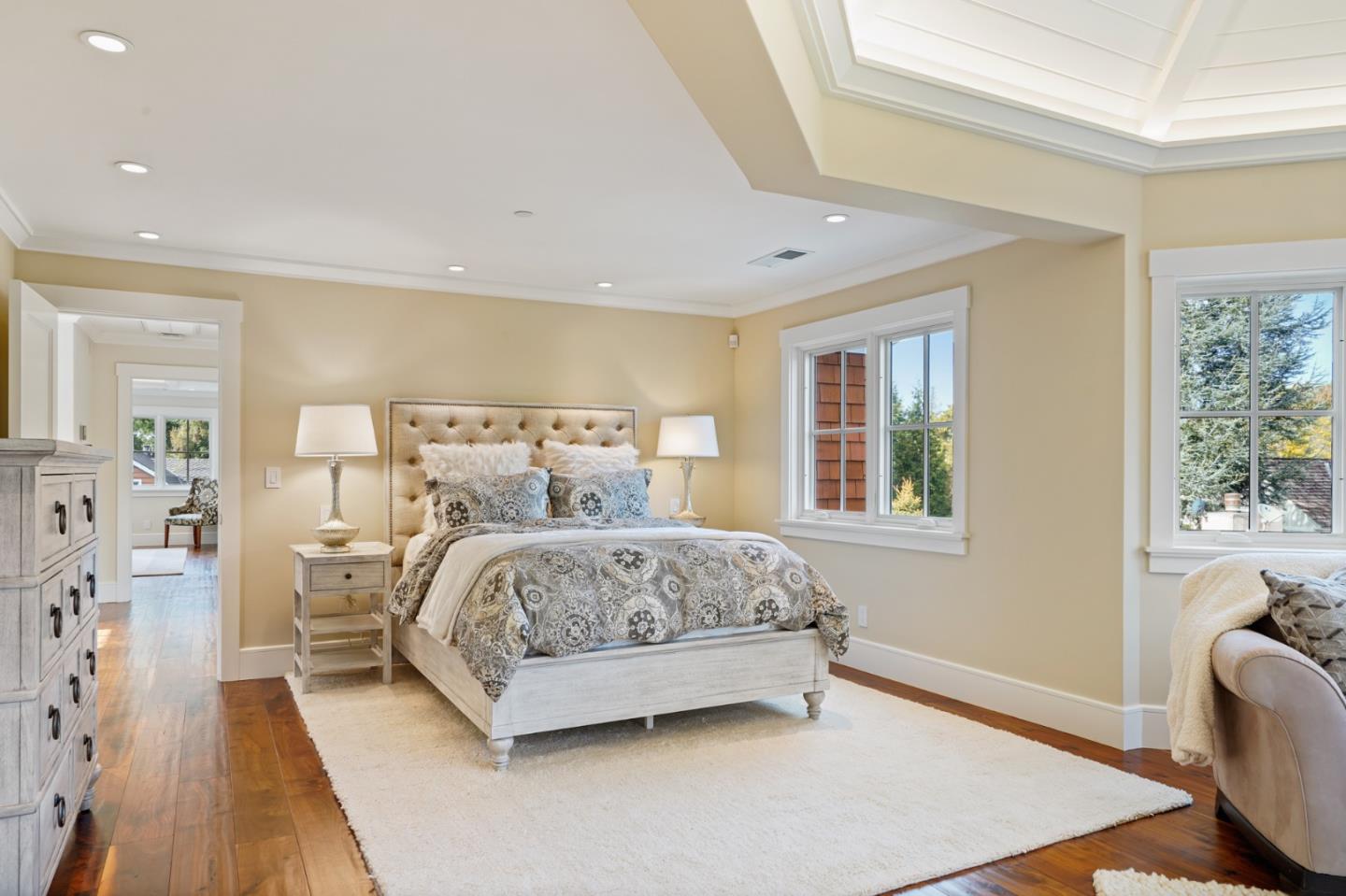 88 Warren Road San Mateo, CA 94401 - Photo 46 of 50 a bedroom with a bed and wooden floor