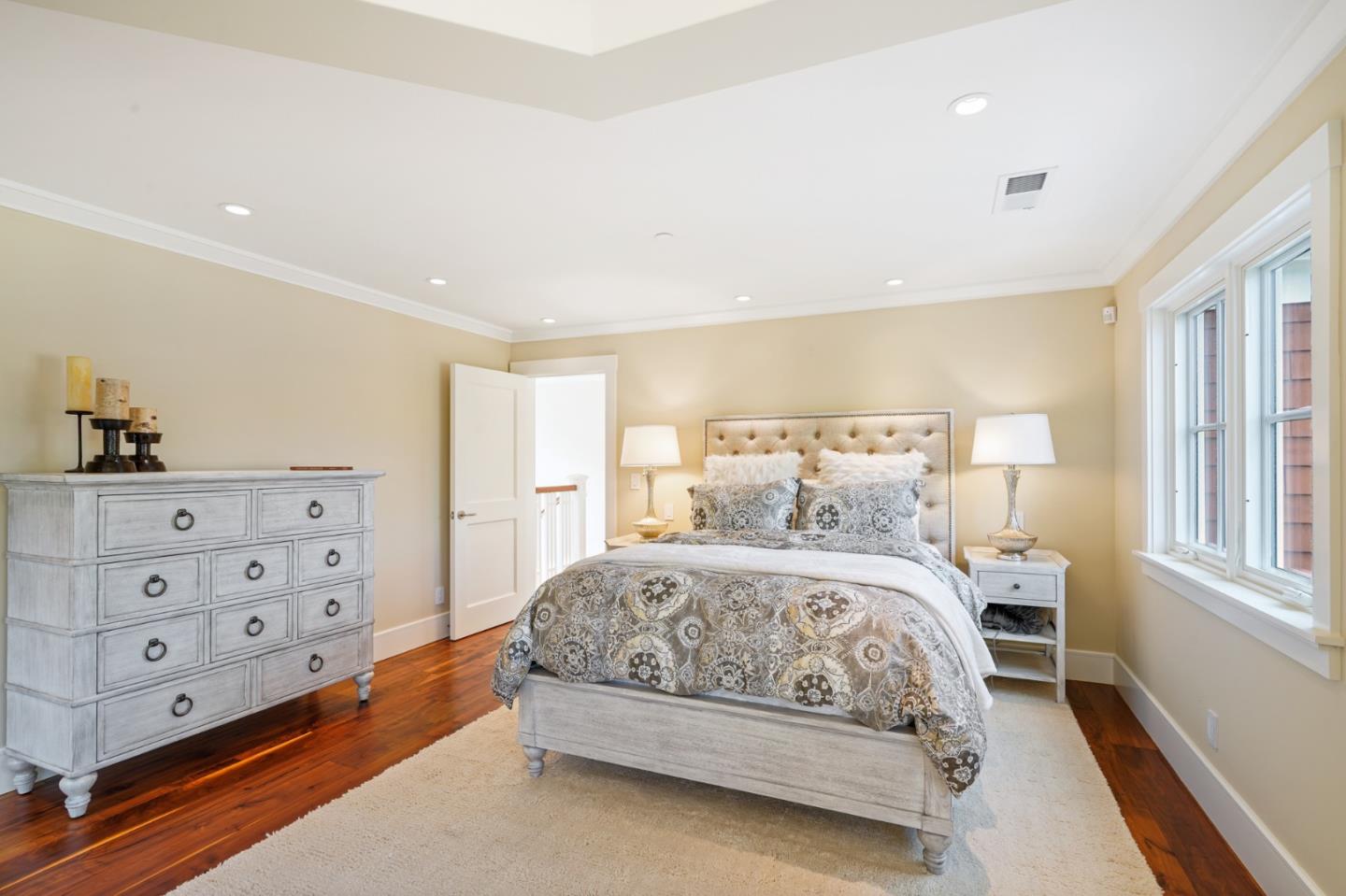 88 Warren Road San Mateo, CA 94401 - Photo 47 of 50 a bedroom with a bed and a cabinets