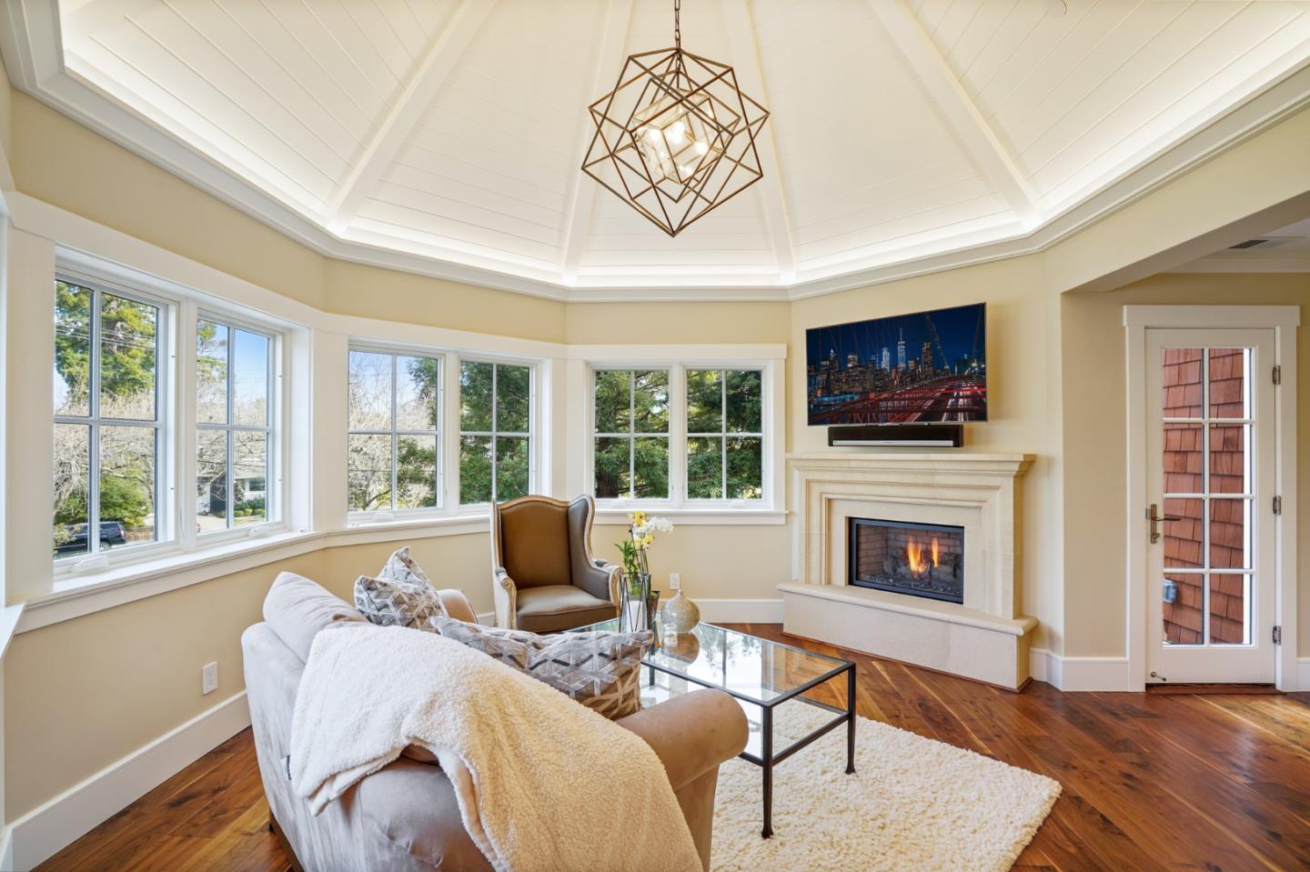 88 Warren Road San Mateo, CA 94401 - Photo 49 of 50 a living room with furniture fireplace and a flat screen tv