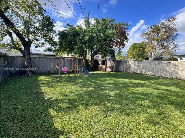 a view of a backyard with a small cabin
