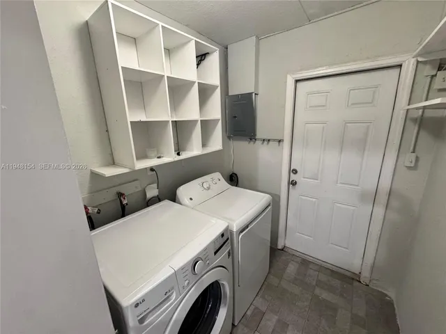 a utility room with dryer and washer