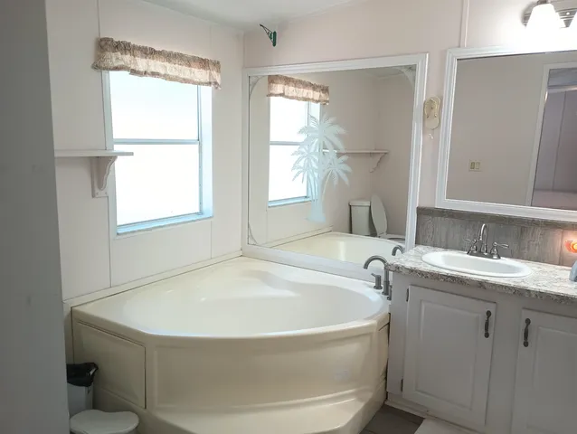 a bathroom with a bathtub and a sink