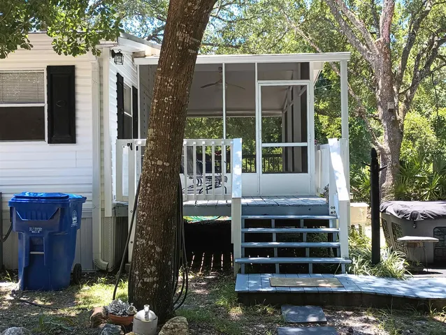 a view of a yard with a tree