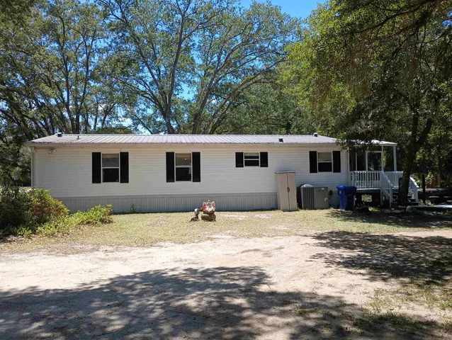 a backyard of a house with lots of green space