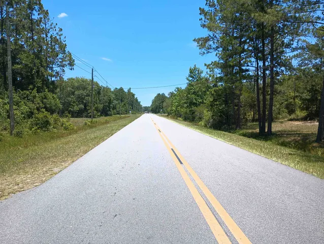 a view of swimming pool with a yard