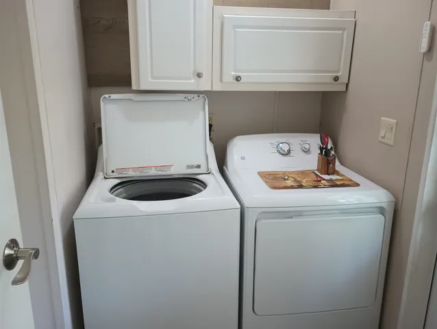 a utility room with dryer and washer