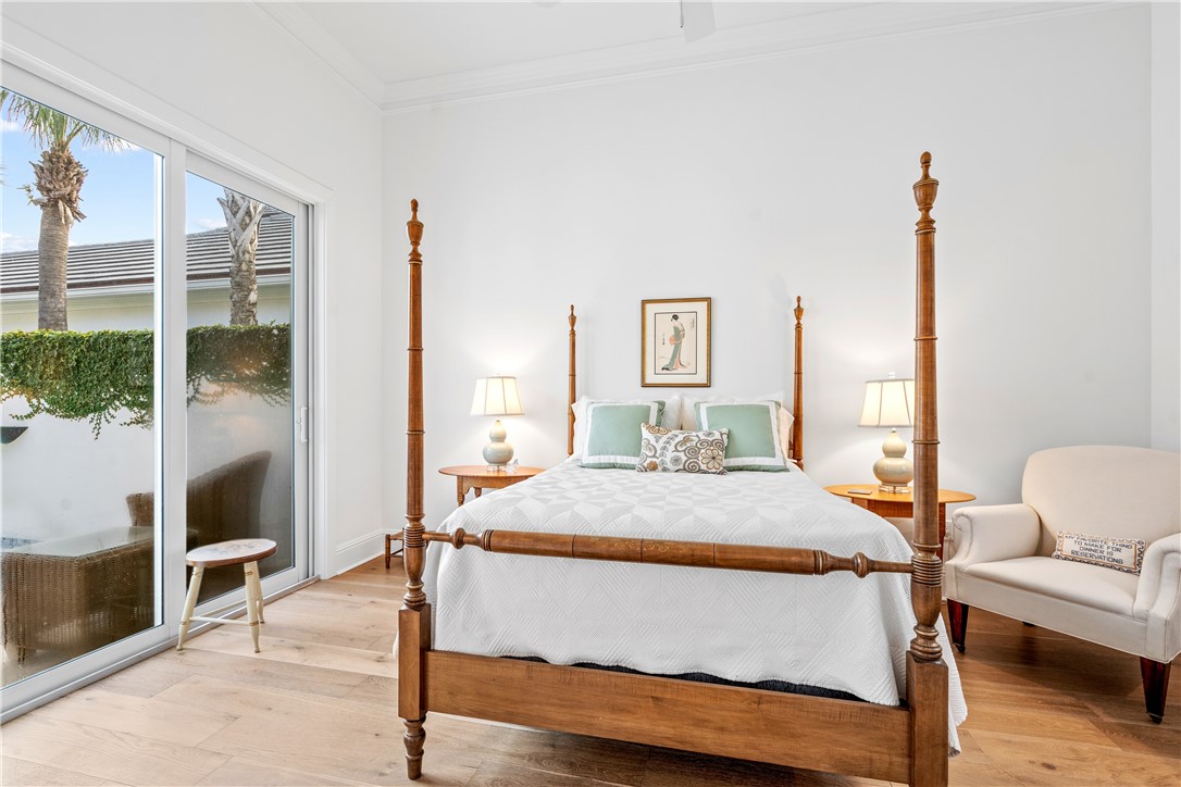 11 Caribe Way Vero Beach, FL 32963 - Photo 23 of 34 a bedroom with a bed and wooden floor