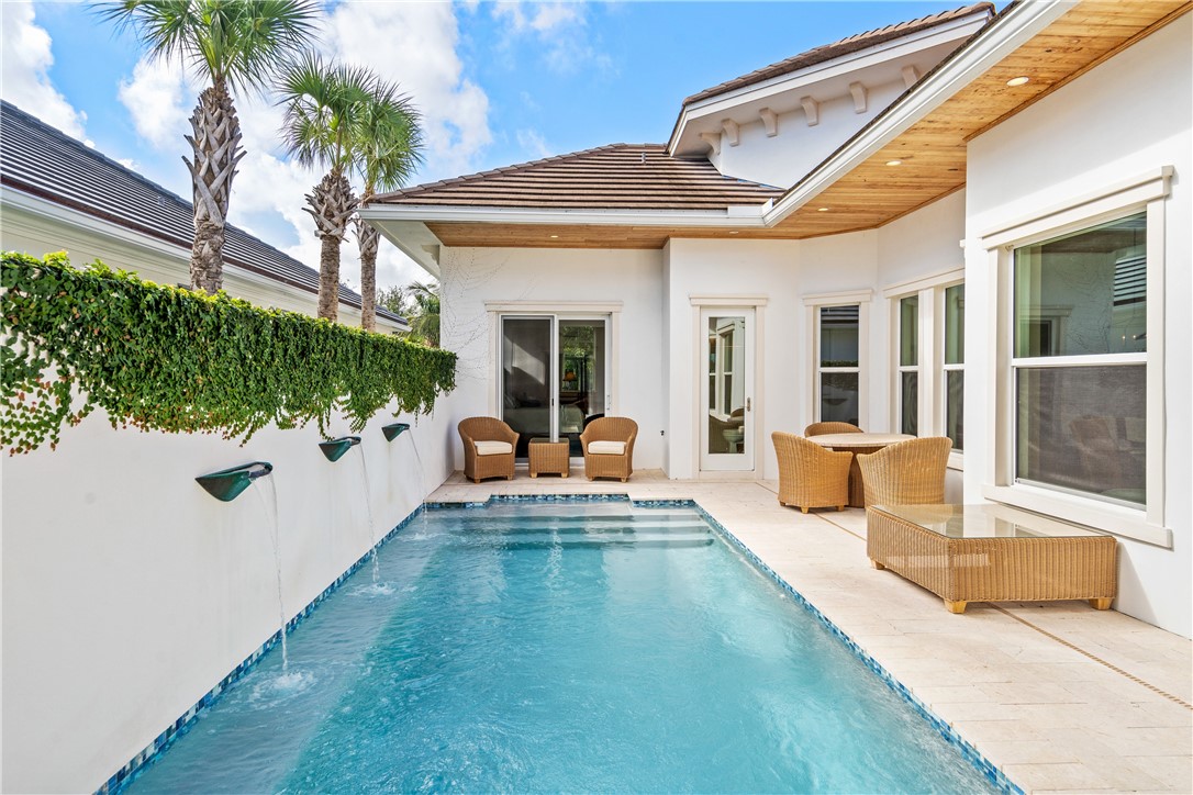 11 Caribe Way Vero Beach, FL 32963 - Photo 30 of 34 a view of a house with swimming pool and sitting area