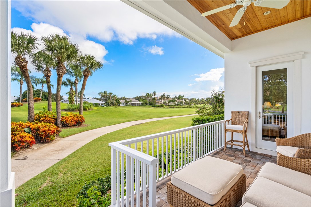 11 Caribe Way Vero Beach, FL 32963 - Photo 31 of 34 a view of a patio with couches table and chairs and potted plants