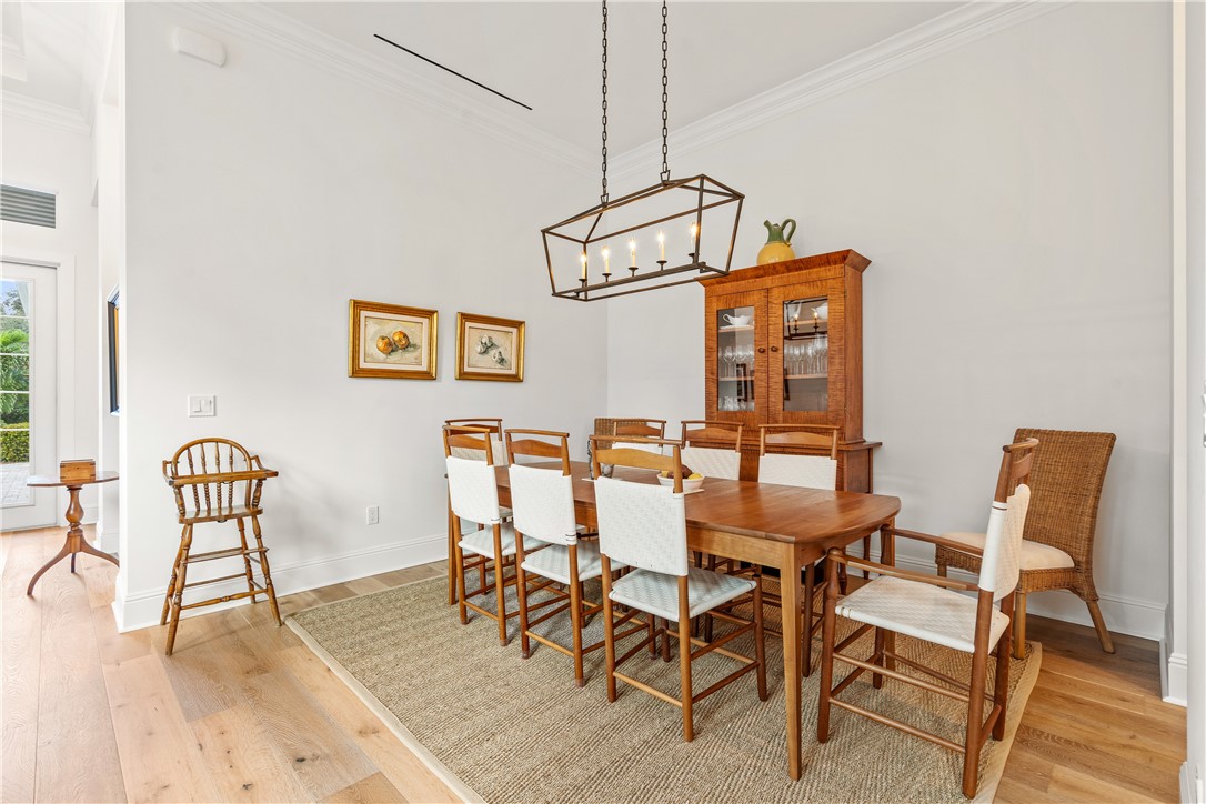 11 Caribe Way Vero Beach, FL 32963 - Photo 7 of 34 a dining room with furniture and wooden floor