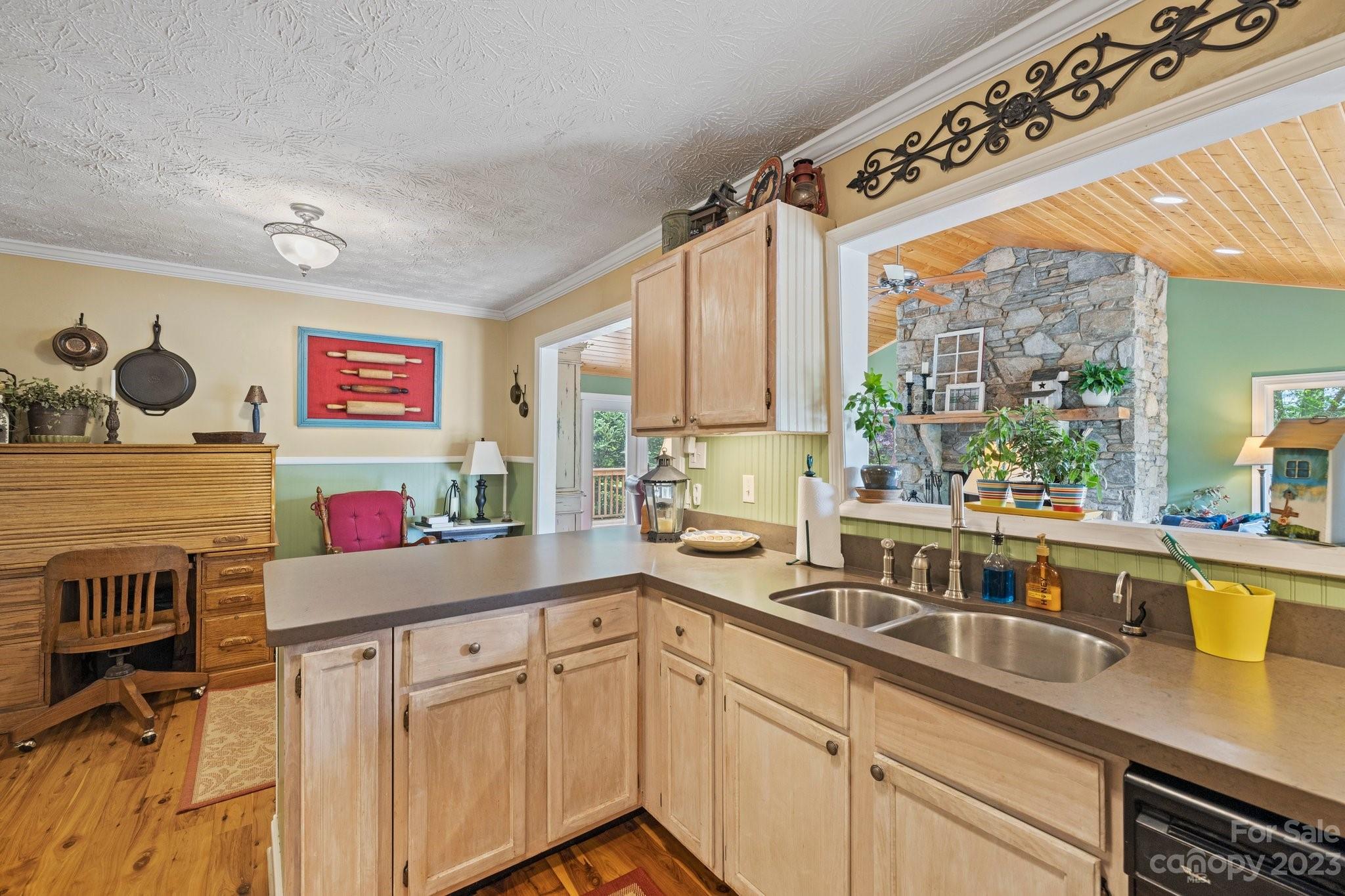 7 Quail Pointe Fletcher, NC 28732 - Photo 11 of 36 a kitchen with a sink stove and cabinets
