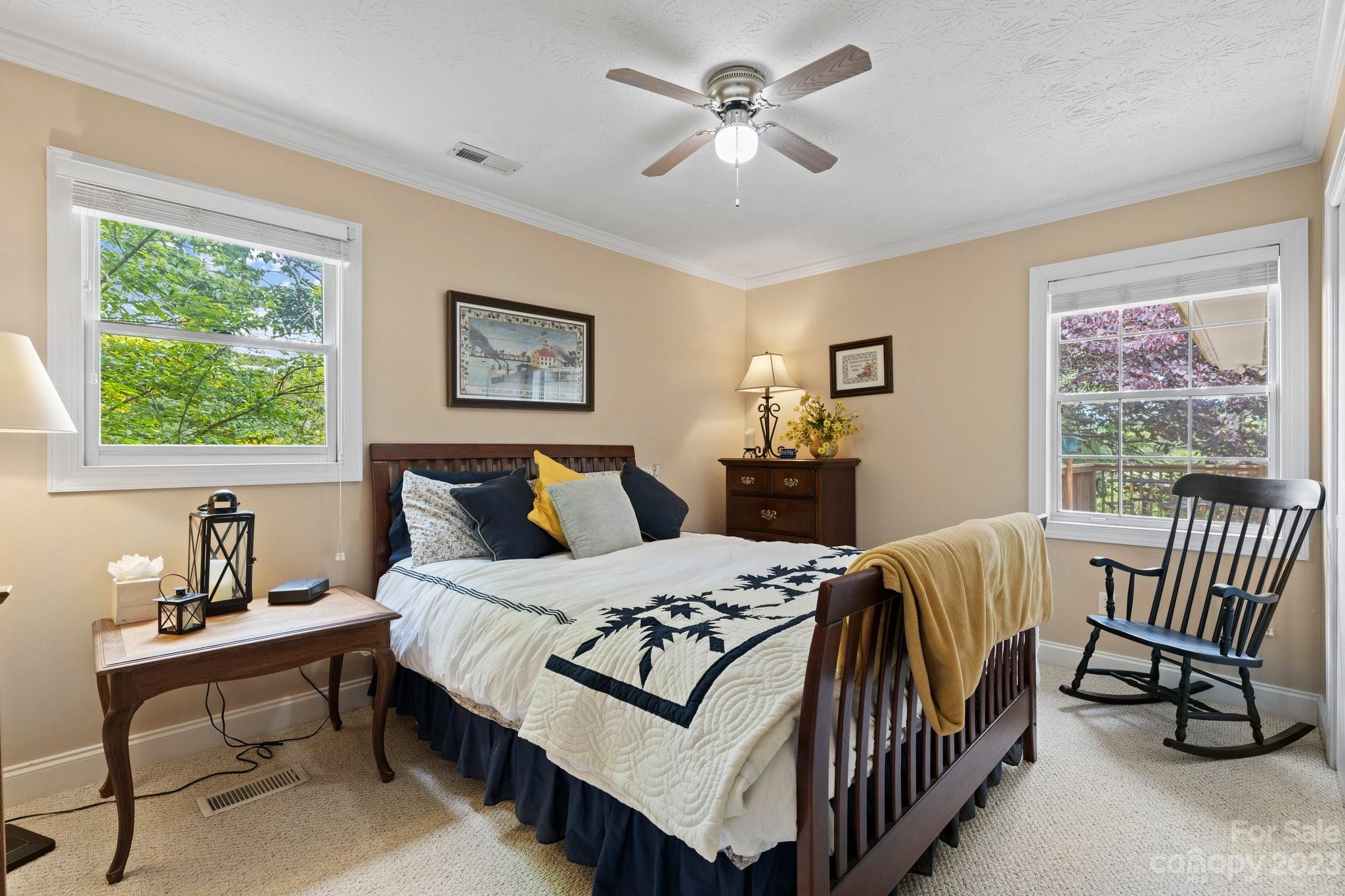 7 Quail Pointe Fletcher, NC 28732 - Photo 18 of 36 a bedroom with a bed a couch and a window