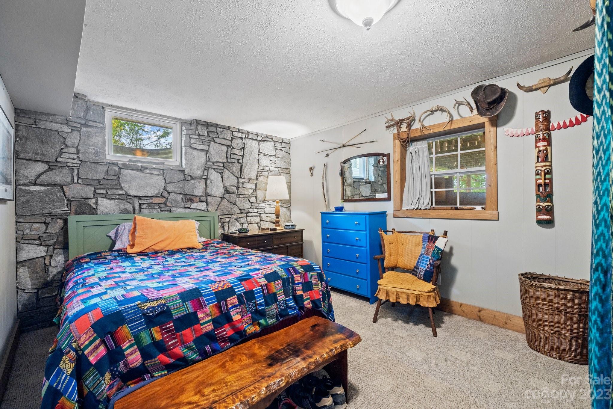 7 Quail Pointe Fletcher, NC 28732 - Photo 22 of 36 a bedroom with a bed and wooden floor