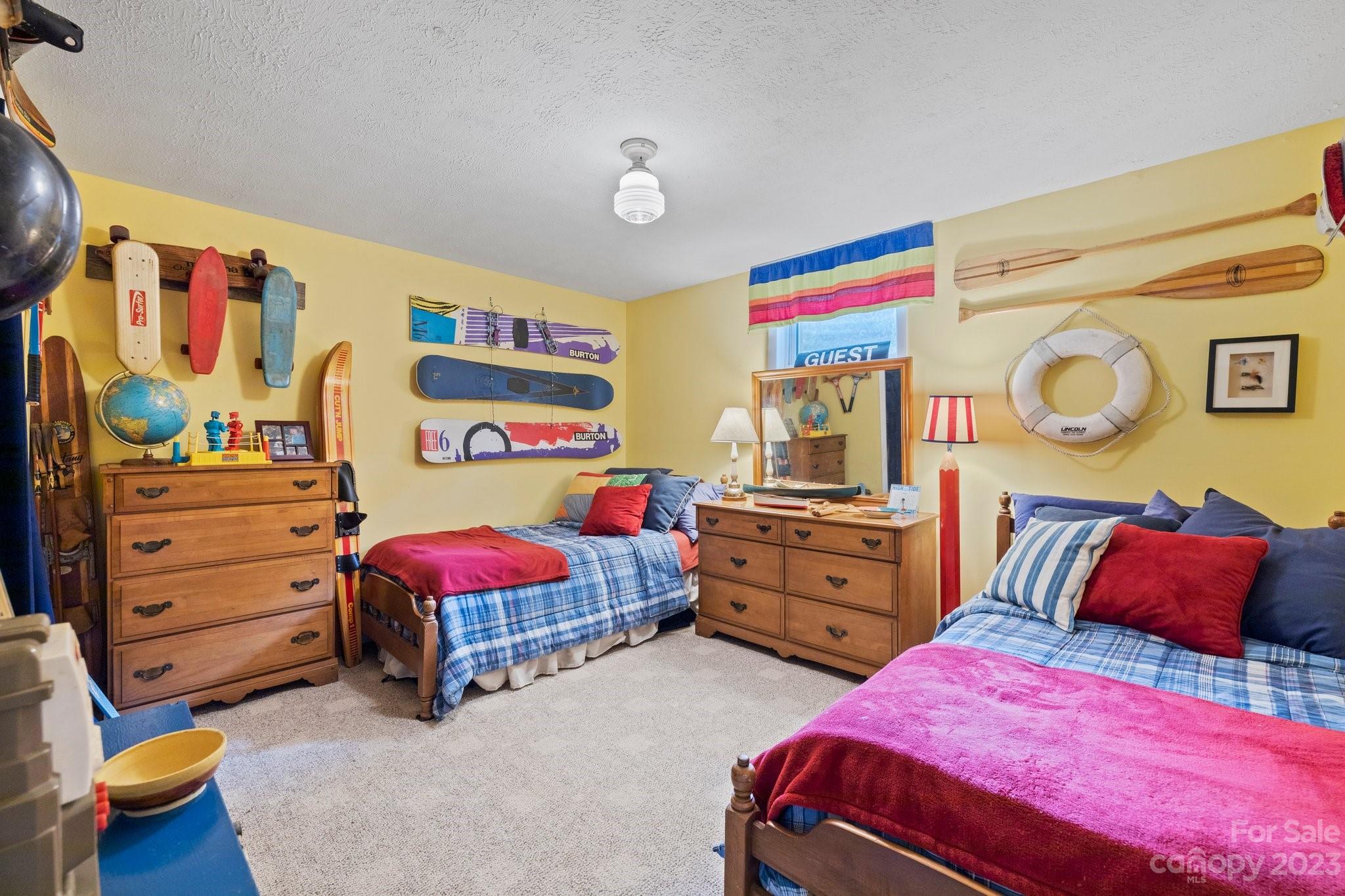 7 Quail Pointe Fletcher, NC 28732 - Photo 23 of 36 a bedroom with a bed and dresser with the shoe rack