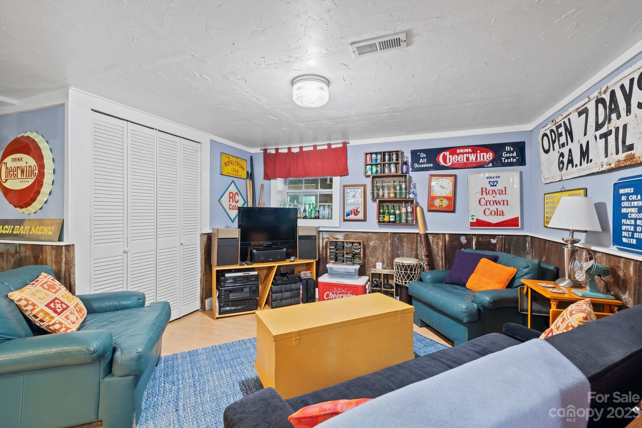 7 Quail Pointe Fletcher, NC 28732 - Photo 26 of 36 a living room with furniture and a flat screen tv