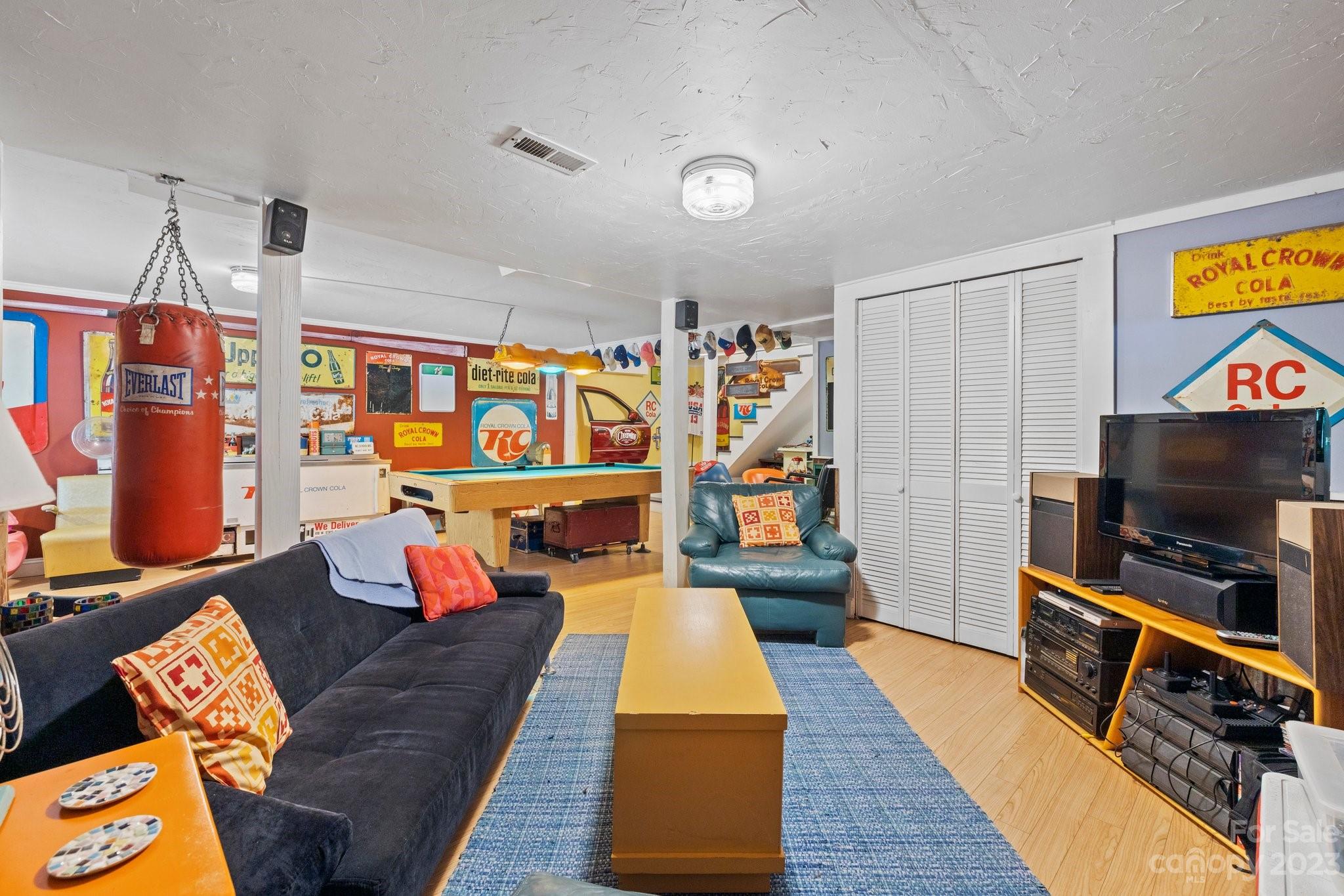 7 Quail Pointe Fletcher, NC 28732 - Photo 27 of 36 a living room with furniture and a flat screen tv