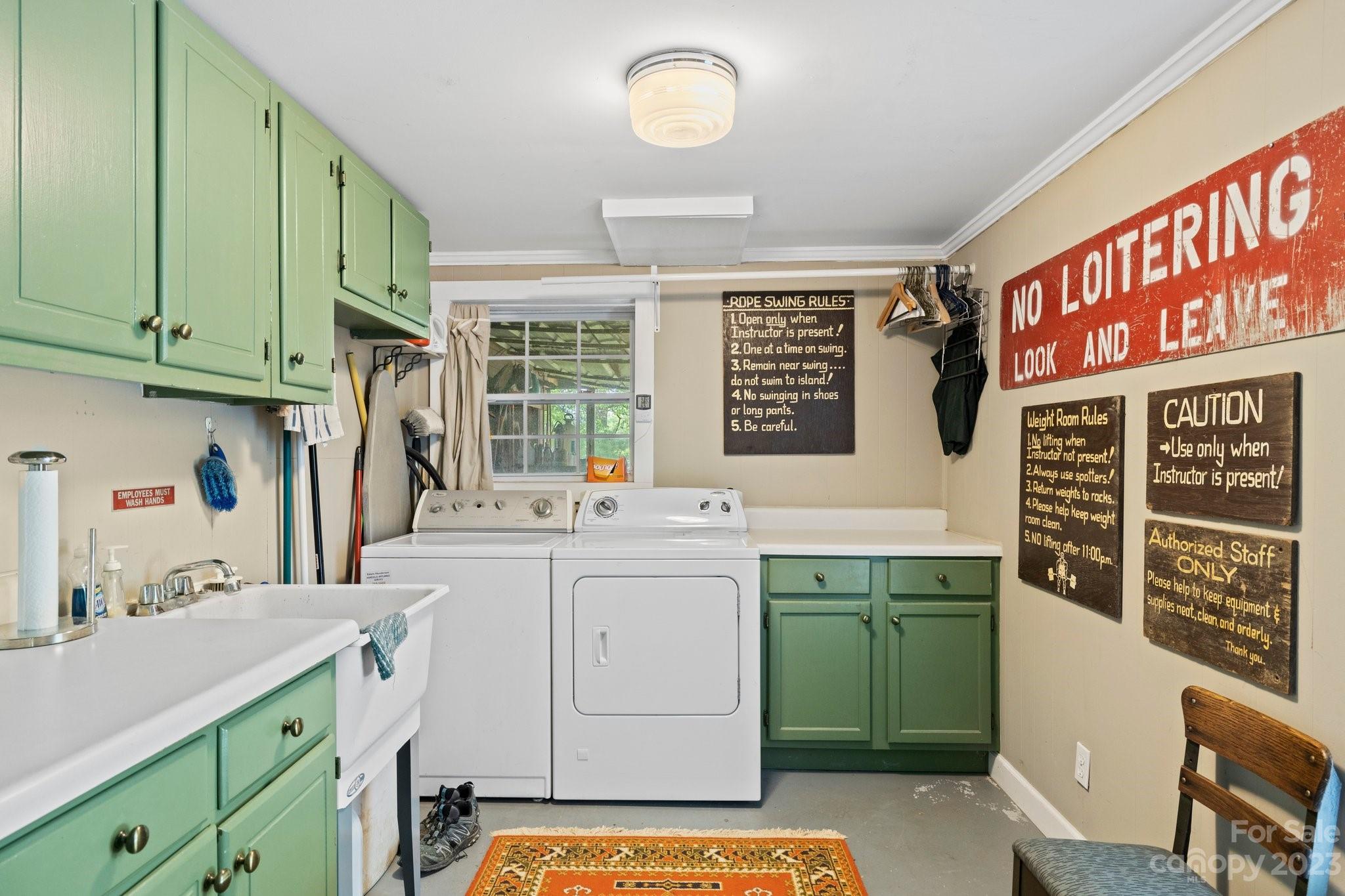 7 Quail Pointe Fletcher, NC 28732 - Photo 29 of 36 a room with a sink and a washer dryer