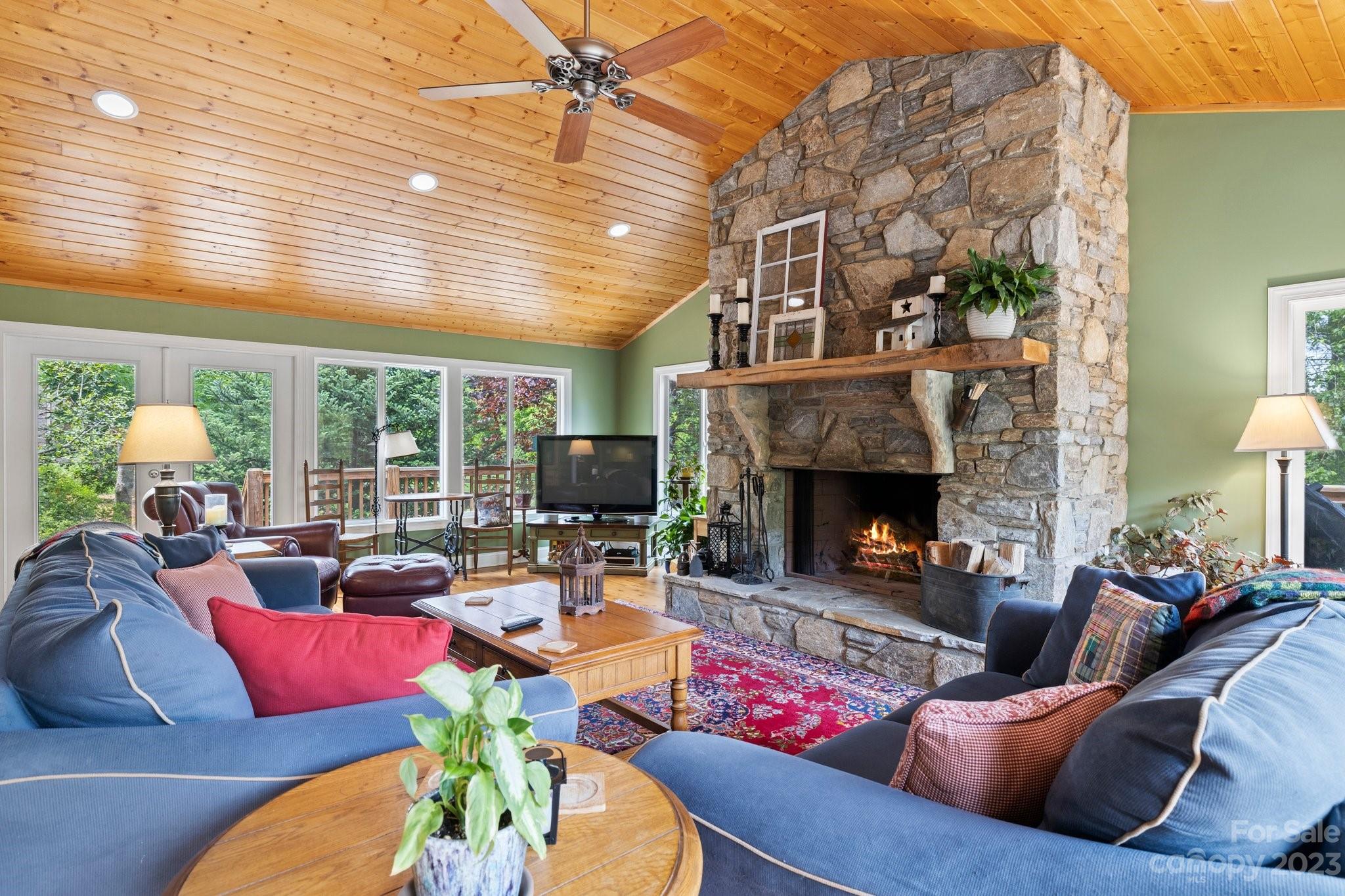 7 Quail Pointe Fletcher, NC 28732 - Photo 5 of 36 a living room with furniture fireplace and a large window