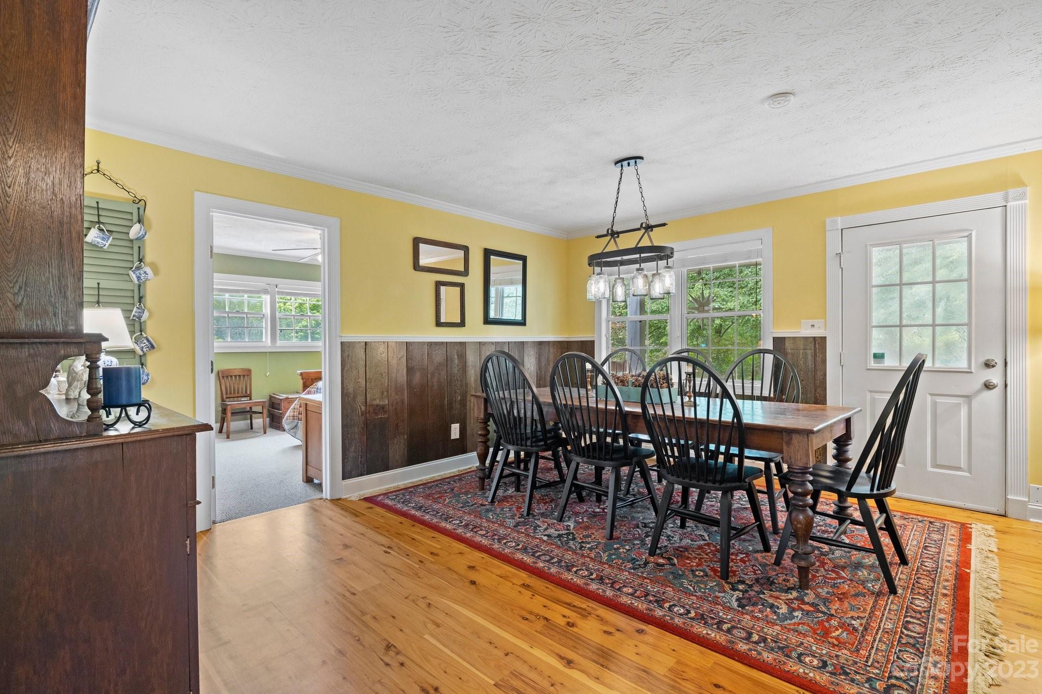 7 Quail Pointe Fletcher, NC 28732 - Photo 9 of 36 a view of a dining room with furniture window and wooden floor