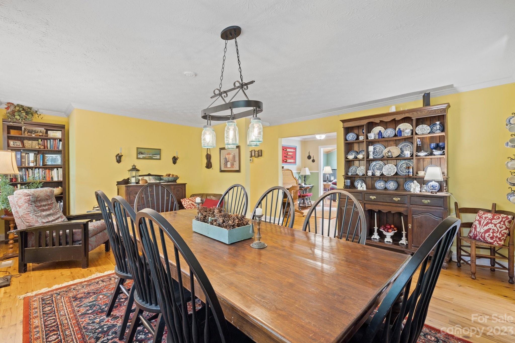 7 Quail Pointe Fletcher, NC 28732 - Photo 10 of 36 a view of a dining room with furniture window and wooden floor