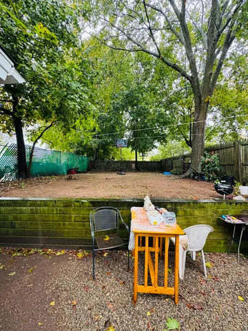 a front view of a house with car parked