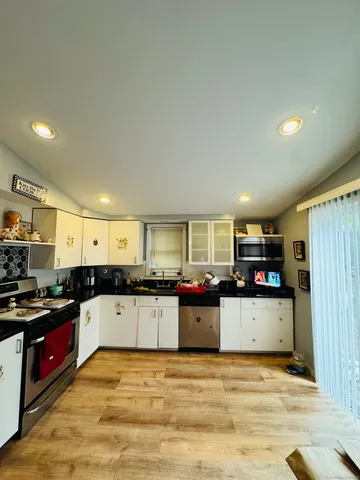 a kitchen with lots of counter top space and a sink