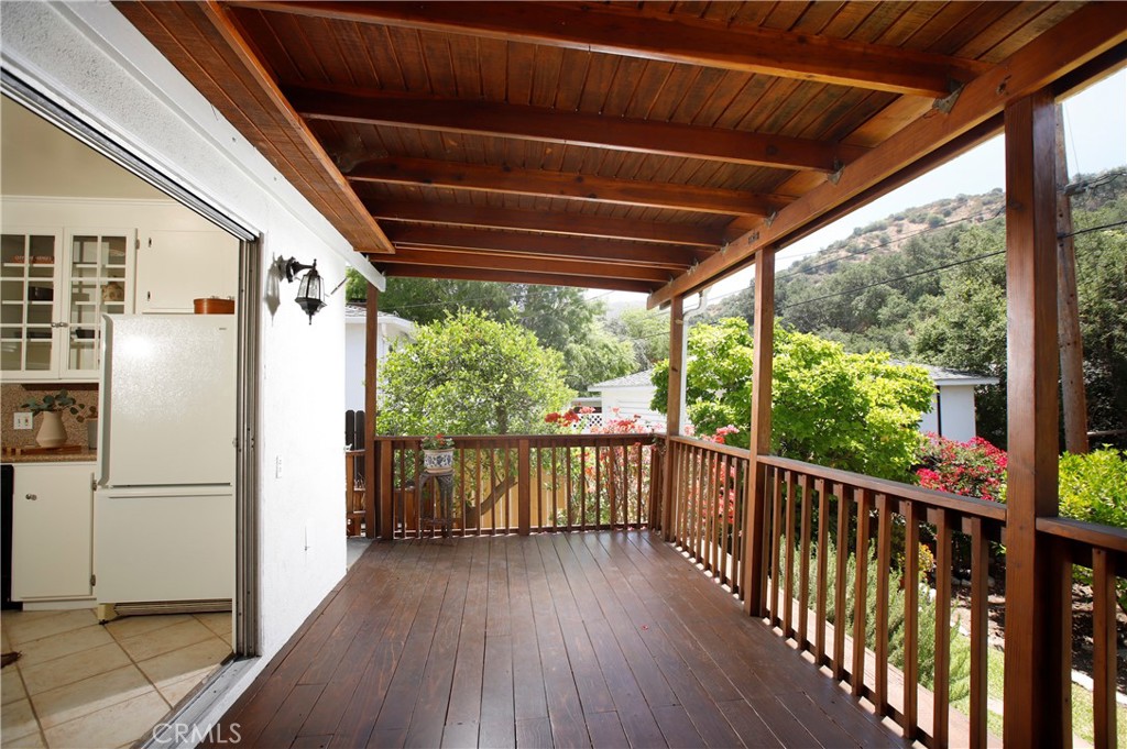 1852 Alpha Road Glendale, CA 91208 - Photo 12 of 28 a view of a balcony with wooden floor and iron stairs