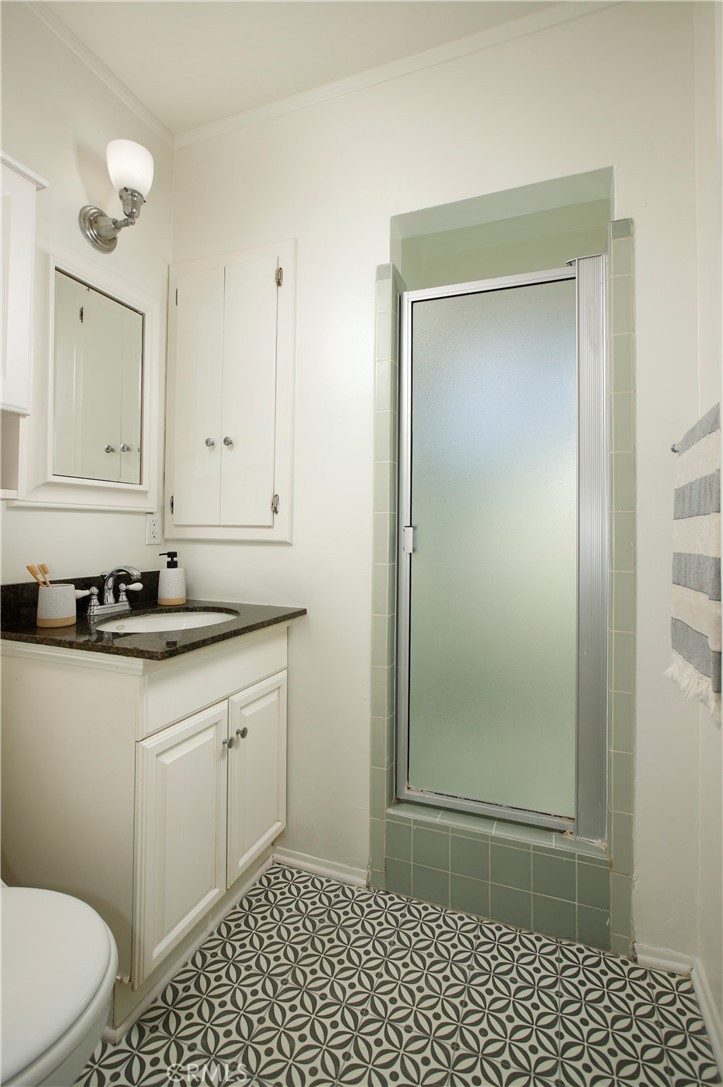 1852 Alpha Road Glendale, CA 91208 - Photo 18 of 28 a bathroom with a sink a toilet and a shower