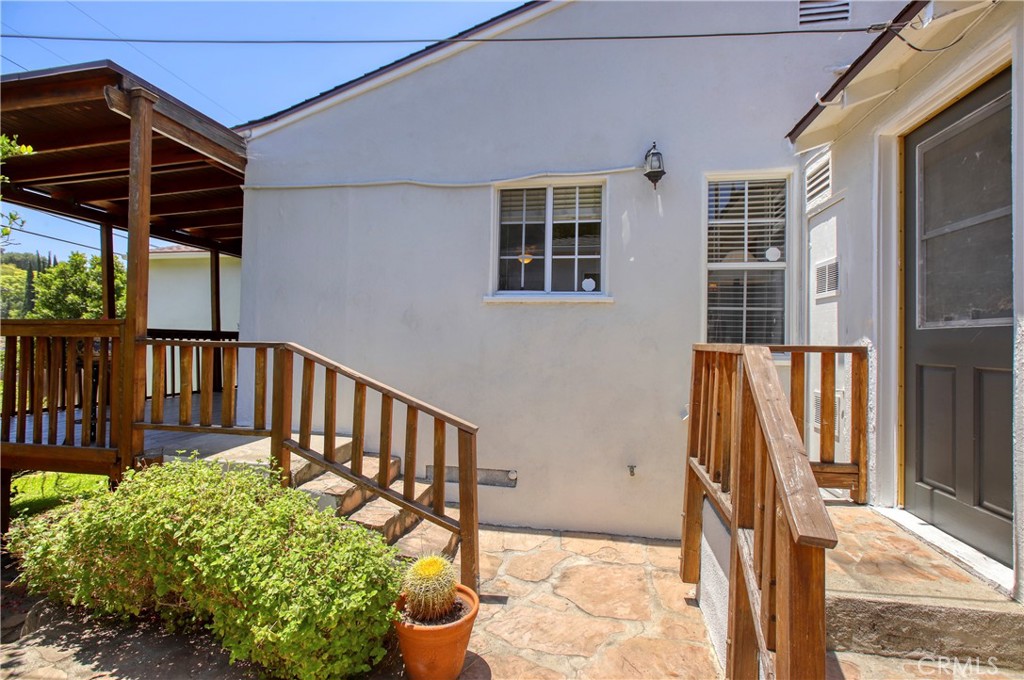 1852 Alpha Road Glendale, CA 91208 - Photo 20 of 28 a view of a backyard with wooden floor and iron fence