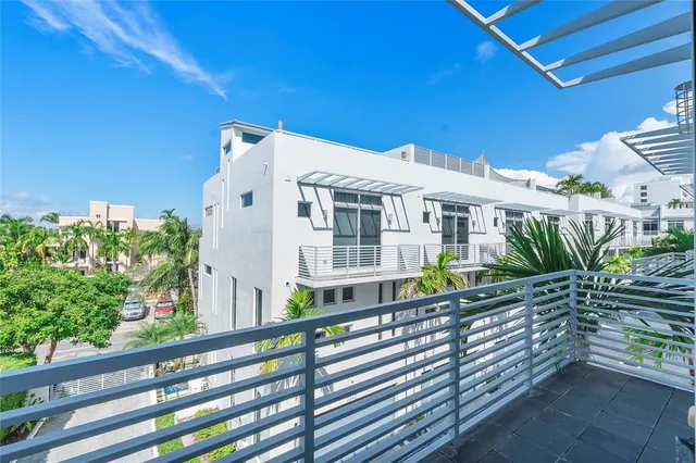 a kitchen with stainless steel appliances granite countertop a sink and a microwave