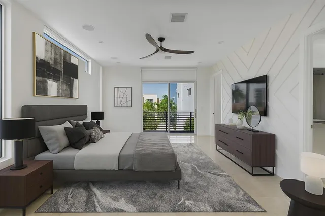 a spacious bedroom with a large bed and a window